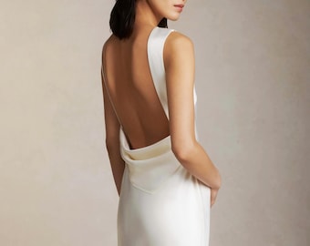 Bridal raised cowl neck, bias cut silk sleeveless gown. Open back with draped accent scarf wedding dress or dress for reception.