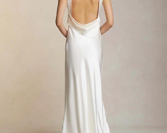 Bridal raised cowl neck, bias cut silk sleeveless gown. Open back with draped accent scarf wedding dress or dress for reception.