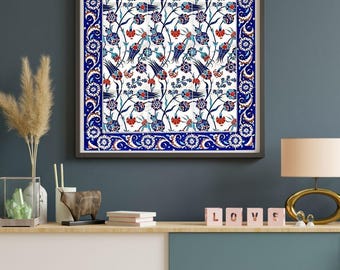 May include: Framed wall art featuring a detailed floral pattern in blue, red, and white on a white background. The artwork has a dark frame and a decorative border. The overall theme is decorative art.