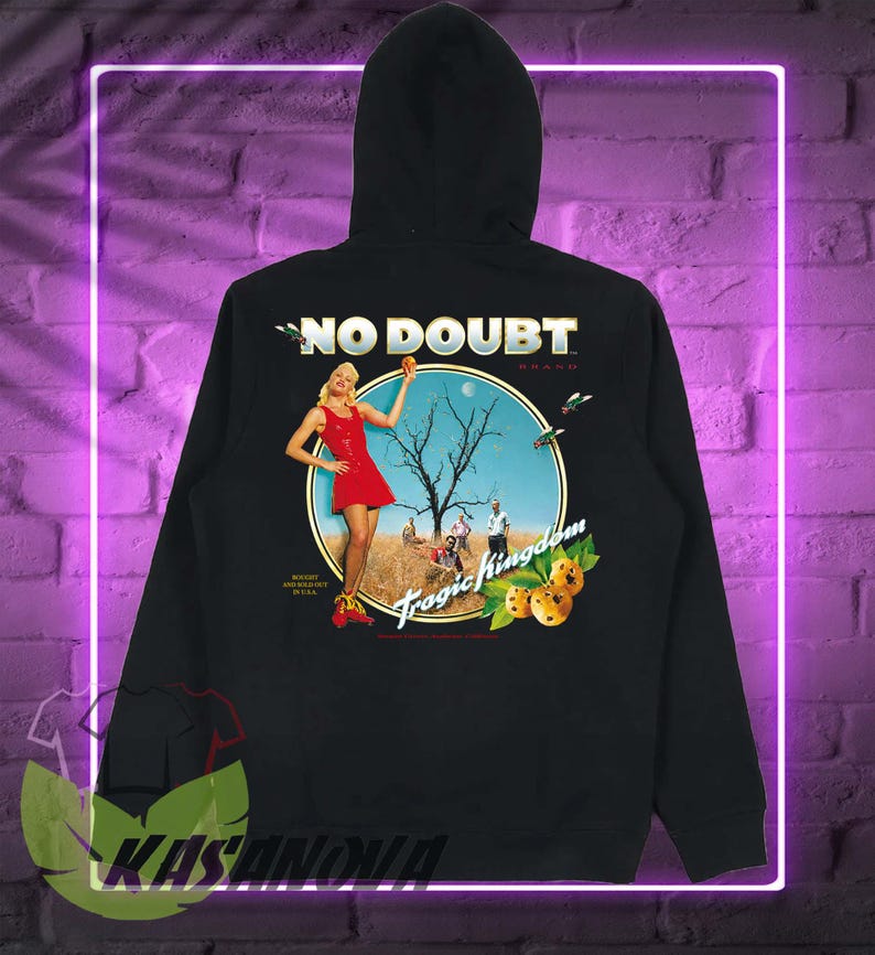 May include: Black hoodie featuring a graphic with the text "NO DOUBT BRAND" above a circular image. The image depicts a woman in a red dress, a barren tree, and the words "Tropic Kingdom".