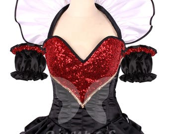 May include: A black and red costume with a white ruffled collar. The bodice features a red sequined center and black sleeves. The skirt has a black and white checkered hemline. The costume is displayed on a mannequin.
