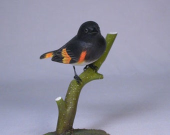 Ave tallada de madera americana redstart