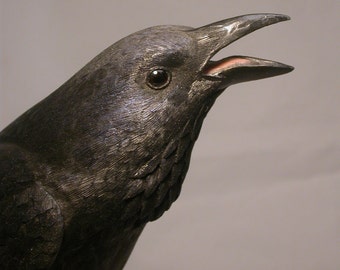 11 inch Common Raven on branch Hand Carved Wooden Bird