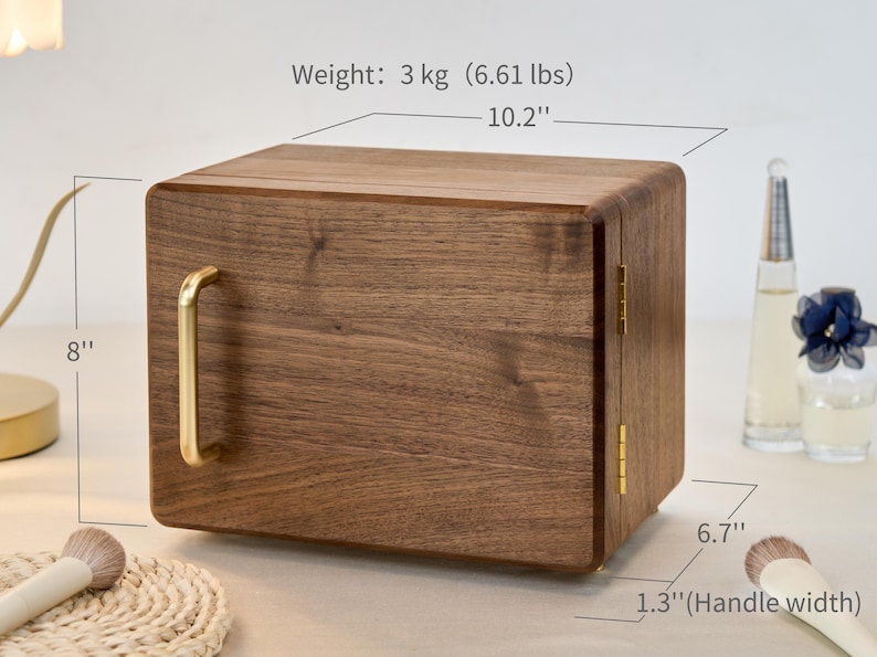 May include: A rectangular wooden storage box with a dark brown wood grain finish, featuring a gold-colored metal handle and hinges. The box measures 10.2 inches wide, 8 inches high, 6.7 inches deep, with a 1.3-inch handle width and weighs 6.61 lbs.