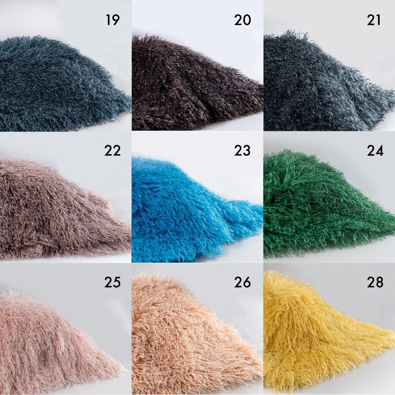May include: A grid of nine swatches of shaggy, long-pile faux fur fabric in various colors, labeled with numbers 19 through 28. The colors include dark blue, dark brown, charcoal, dusty rose, bright blue, emerald green, light pink, beige, and yellow.