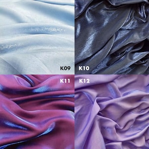 May include: A four-quadrant display of shimmering fabric swatches. Top left K09 is light blue, top right K10 is dark navy blue, bottom left K11 is iridescent purple and blue, and bottom right K12 is light lavender. Each section shows fabric folds.