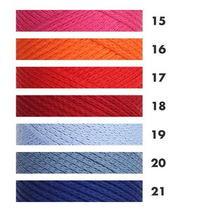 May include: A color chart of yarn skeins in various shades of pink, orange, red, blue, and navy. Each color is labeled with a number from 15 to 21. The yarn appears to be soft and suitable for knitting or crochet projects.
