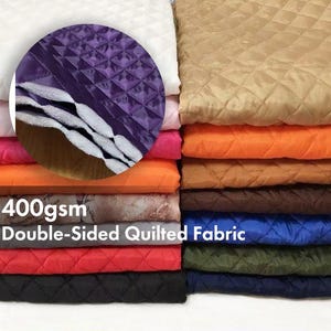 May include: A selection of double-sided quilted fabric in a range of colours, such as white, tan, orange, brown, red, and black. The image includes the text "400gsm Double-Sided Quilted Fabric".
