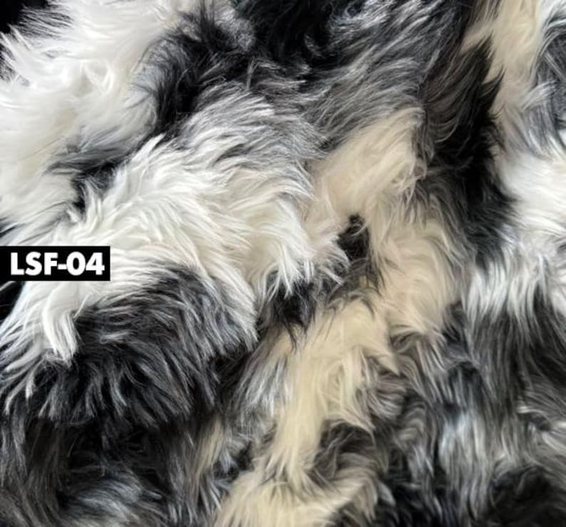 May include: Close-up of a faux fur fabric with a mix of black, white, and gray fibers. The fabric has a shaggy texture and a dense pile. The text "LSF-04" is in a black rectangle in the lower left corner.