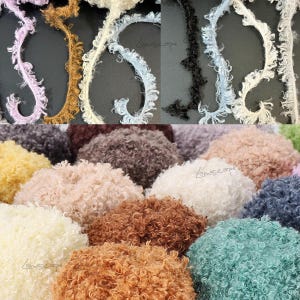May include: A collection of textured trim and fluffy fabric swatches in various colors including lavender, brown, cream, light blue, black, yellow, gray, and teal. The trim features a frayed, eyelash-like edge, while the fabric has a dense, curly pile.