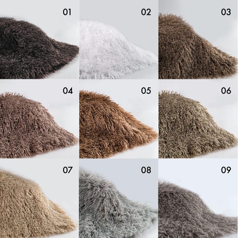 May include: A grid of nine bucket hats made from long-pile faux fur material, each labeled with a number from 01 to 09. The hats are displayed in various colors including black, white, dark brown, light brown, tan, gray, and charcoal tones.