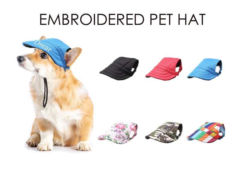 May include: A blue, red, black, camouflage, and floral patterned pet hat with a white embroidered name "Oscar" on the blue hat. The hats are designed for dogs and are shown on a white background.