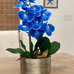 Blue orchids artificial arrangement