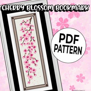May include: A framed cross-stitch bookmark featuring a cherry blossom design. The bookmark has a white background with pink cherry blossoms and brown stems. The text "CHERRY BLOSSOM BOOKMARK" is at the top, and a circle with "PDF PATTERN" is on the right.