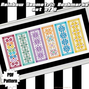 May include: Set of six geometric rainbow bookmarks with colorful cross-stitch patterns. Each bookmark features a unique design in shades of red, orange, yellow, green, blue, and purple. The text "Rainbow Geometric Bookmarks set of 6" is at the top.