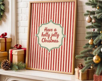 May include: A framed Christmas print with a red and white striped design. The print displays the text "Have a holly jolly Christmas" within a decorative border. A Christmas tree and wrapped gifts are visible.