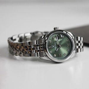Elegant Stainless Steel Women’s Watch with Green Dial and Crystal Hour Markers | Modern and Sophisticated Design