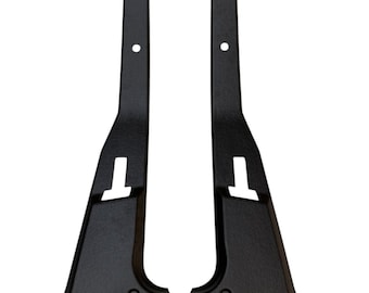 May include: A pair of black plastic car door trim pieces. The trim pieces have a textured surface and are designed to fit on the inside of a car door.