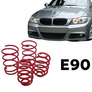 May include: A silver BMW E90 car with a black grille and red coil springs. The springs are in a group of four, with the text "E90" in black.