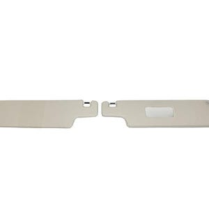 May include: A pair of beige car sun visors. The visor on the right has a small rectangular mirror.