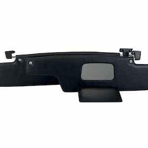May include: A pair of black car sun visors with a flip-down extension. The visors have a rectangular window in the centre.