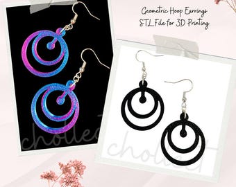 May include: A pair of geometric hoop earrings with a double circle design. The earrings are shown in two versions: one with a glittery blue and pink finish and the other in black. The image includes the text "Geometric Hoop Earrings STL File for 3D Printing".