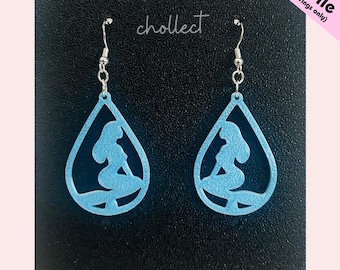 May include: Pale blue teardrop-shaped earrings with a mermaid design. The earrings hang from silver-coloured hooks. The word "chollect" is written in cursive. The text "STL File (for earrings only)" is in the upper right corner.