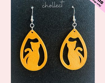 May include: A pair of orange teardrop earrings with a cat silhouette cutout. The earrings hang from silver-colored hooks. The word "chollect" is written in cursive above the earrings. The text "STL File (for earrings only)" is in the upper right corner.