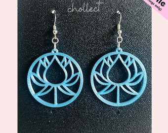 May include: A pair of light blue, circular earrings featuring a lotus flower design, suspended from silver-coloured hooks. The image also includes the text "STL File (for earrings only)" and the word "chollect".
