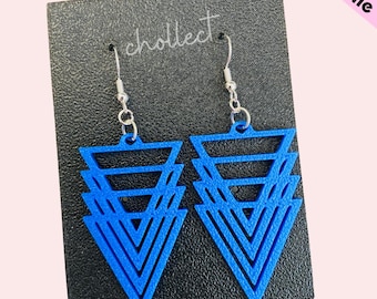 May include: A pair of blue geometric triangle earrings with silver hooks. The earrings are layered and have a modern design.