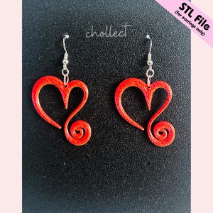 May include: A pair of red heart-shaped earrings with a swirl design. The earrings are suspended from silver-coloured hooks. The image also includes the text "STL File (for earrings only)" and the word "chollect".