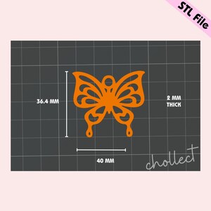 May include: Orange butterfly-shaped design with intricate cutouts, measuring 40 mm wide and 36.4 mm tall. The design is 2 mm thick.
