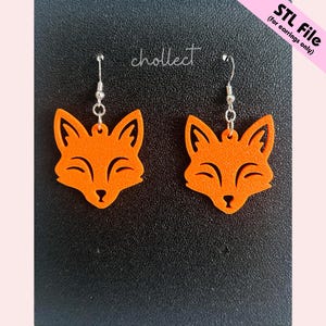 May include: A pair of orange fox-shaped earrings with silver hooks. The earrings are displayed on a black surface with the word "chollect" in cursive. The text "STL File (for earrings only)" is in the upper right corner.