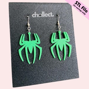 May include: A pair of green spider-shaped earrings with silver-colored hooks. The earrings are displayed on a black textured surface. The text "STL File (for earrings only)" is in the upper right corner.