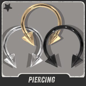 May include: Three horseshoe-shaped piercings in gold, silver, and black. Each has a conical spike at the bottom. The word "PIERCING" is at the bottom of the image.