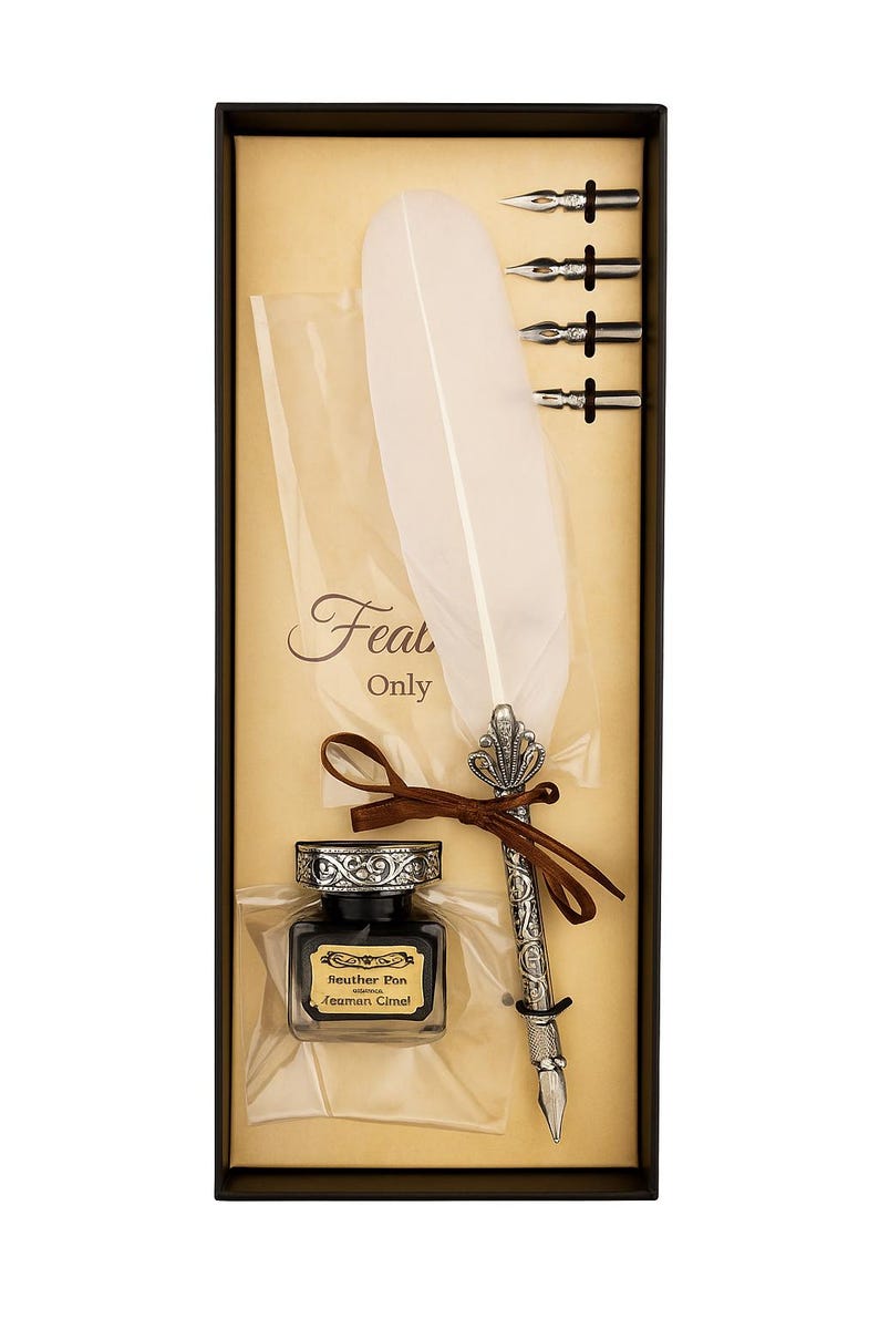 May include: A calligraphy set in a gift box. The set includes a silver-colored pen with a feather, three nibs, a bottle of ink, and a large white feather. The box has the words "Feat Only" printed on it.