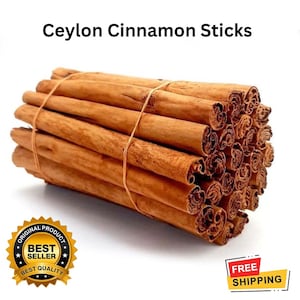 May include: A bundle of Ceylon cinnamon sticks, tied with twine. The sticks are a warm brown color, with a rolled appearance. Text at the top reads "Ceylon Cinnamon Sticks". A gold seal with "Best Seller" is in the lower left.