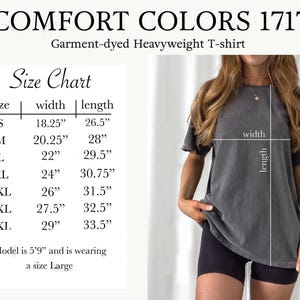 May include: Size chart for a garment-dyed heavyweight t-shirt. The chart shows the width and length measurements in inches for sizes S, M, L, XL, 2XL, 3XL, and 4XL. The model is wearing a size Large.