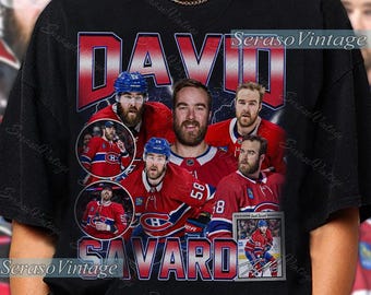 May include: Black t-shirt featuring a graphic of David Savard, a hockey player, in a vintage style. The design includes multiple images of the player in his Montreal Canadiens uniform, with the name "DAVID SAVARD" in bold red letters.