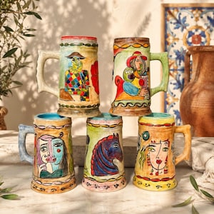 May include: Five ceramic beer steins featuring hand-painted, colorful abstract figures and animal motifs. Each mug has a sturdy handle and decorative borders in shades of red, green, blue, and yellow, showcasing distinct artistic illustrations.