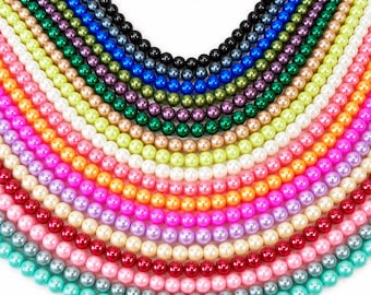 May include: A collection of multiple strands of round, smooth, lustrous beads arranged in a semi-circular pattern. The beads are presented in a wide spectrum of colors including black, blue, green, purple, yellow, white, orange, pink, red, and teal.