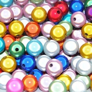 May include: A collection of round, iridescent beads in various colors, including gold, silver, blue, red, green, and purple. The beads have a smooth, shiny finish and are perfect for crafting jewelry or other decorative projects.