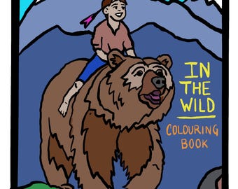 May include: A coloring book cover featuring a cartoon illustration of a child riding a brown bear in a mountainous landscape. The text "IN THE WILD COLORING BOOK" is displayed in yellow and black lettering.