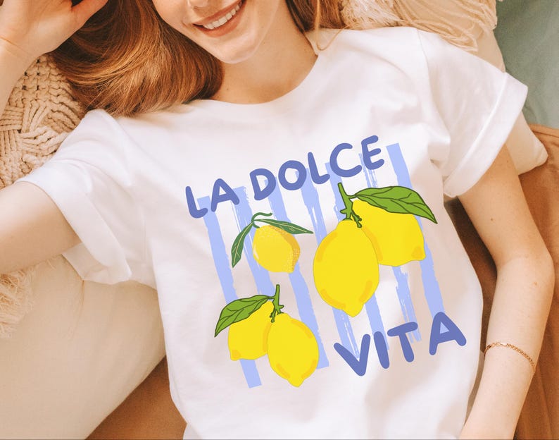 a woman wearing a t - shirt with lemons on it