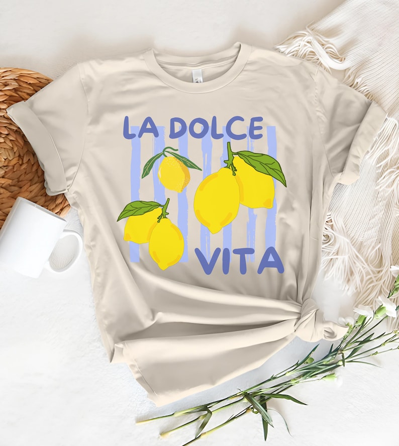 a t - shirt that says la dolce vita with lemons on it