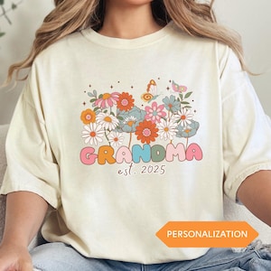 Custom New Grandma Shirt Wildflowers Tee Promoted to Grandma Est 2025 Pregnancy Reveal Gift for Grandmother Mothers Day Surprise Tee