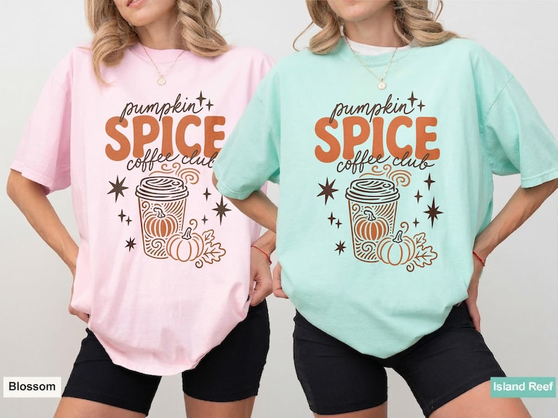 Two women wear graphic tees with pumpkin spice coffee club design.