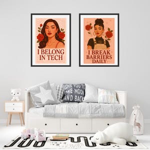 May include: Two framed illustrations of women with red roses. The first illustration features a woman with brown hair and the text "I belong in tech". The second illustration features a woman with brown hair in a denim jumpsuit and the text "I break barriers daily".