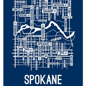 May include: A navy blue print of a map of Spokane, Washington, with white street names and a white outline of the Spokane River. The word "Spokane" is printed in large white letters at the bottom of the image.