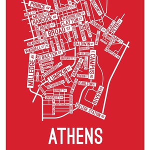 May include: A red and white map of Athens, Georgia, with the names of streets and avenues printed in white. The city's name is printed in large white letters at the bottom of the map.